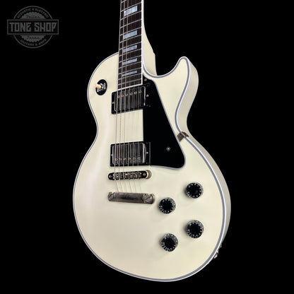 White electric guitar on a black background with 'Tone Shop' logo.