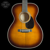 Front of Martin Custom Shop 28 Style OM Adirondack/Pacific Big Leaf Flamed Maple Ambertone.