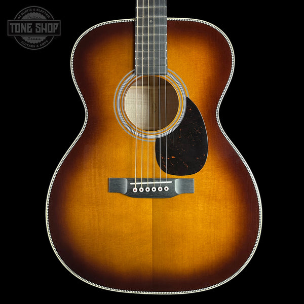 Front of Martin Custom Shop 28 Style OM Adirondack/Pacific Big Leaf Flamed Maple Ambertone.