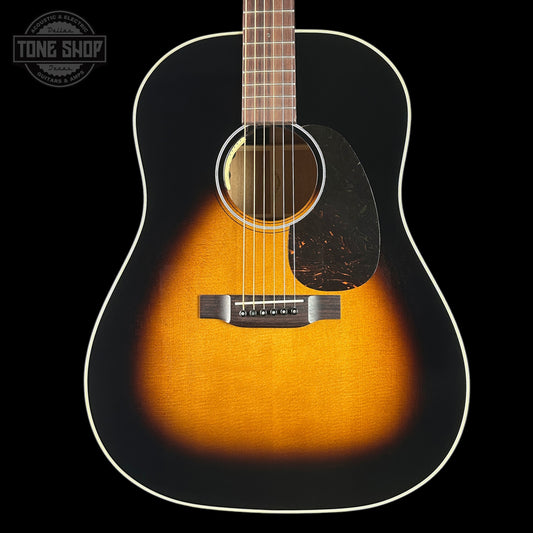 Acoustic guitar with a sunburst finish on a black background, featuring the Tone Shop logo.
