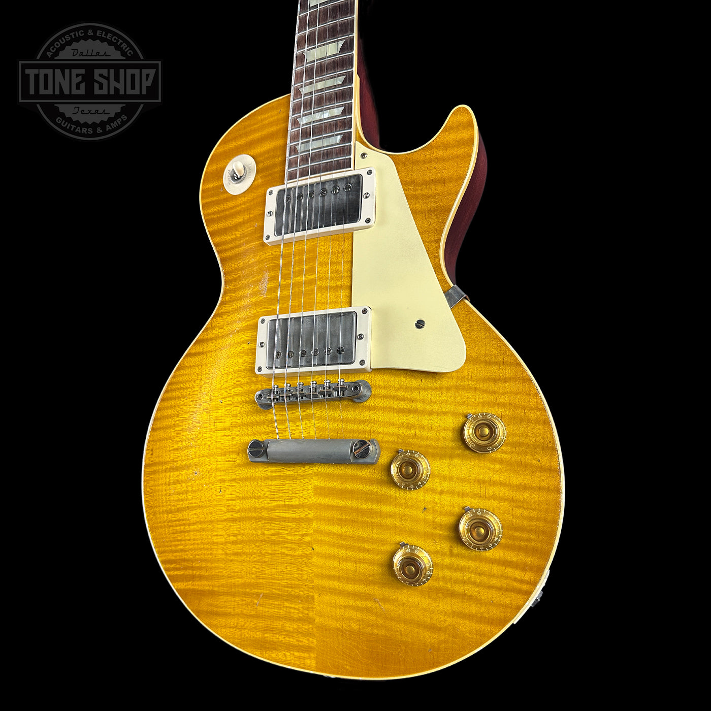 Yellow electric guitar with a black background