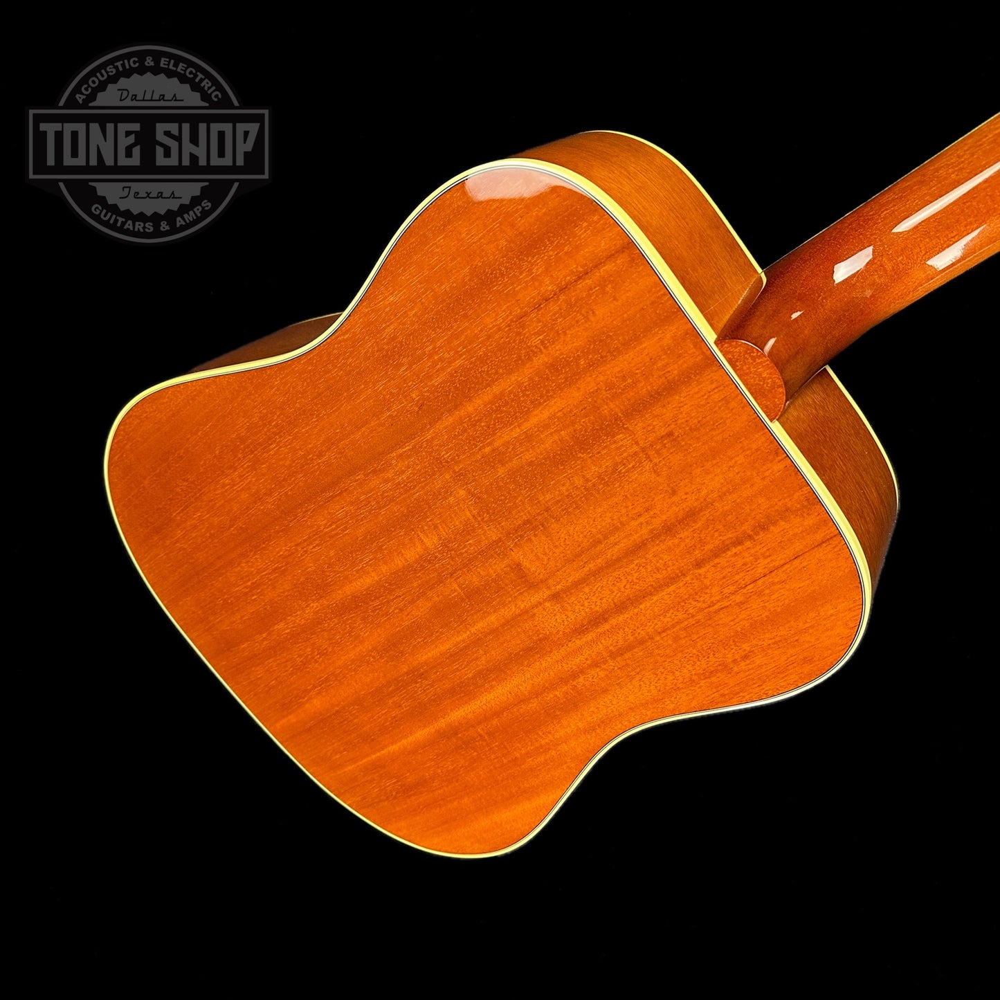 Back angle of Gibson Custom Shop M2M Hummingbird Original Adj Red Spruce Top Heritage Cherry Burst.