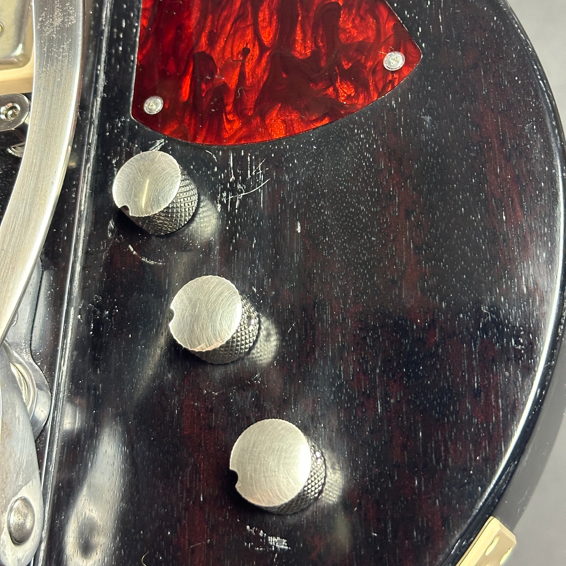 Scratches near controls of Used 2022 Eastman Juliet Black Varnish.