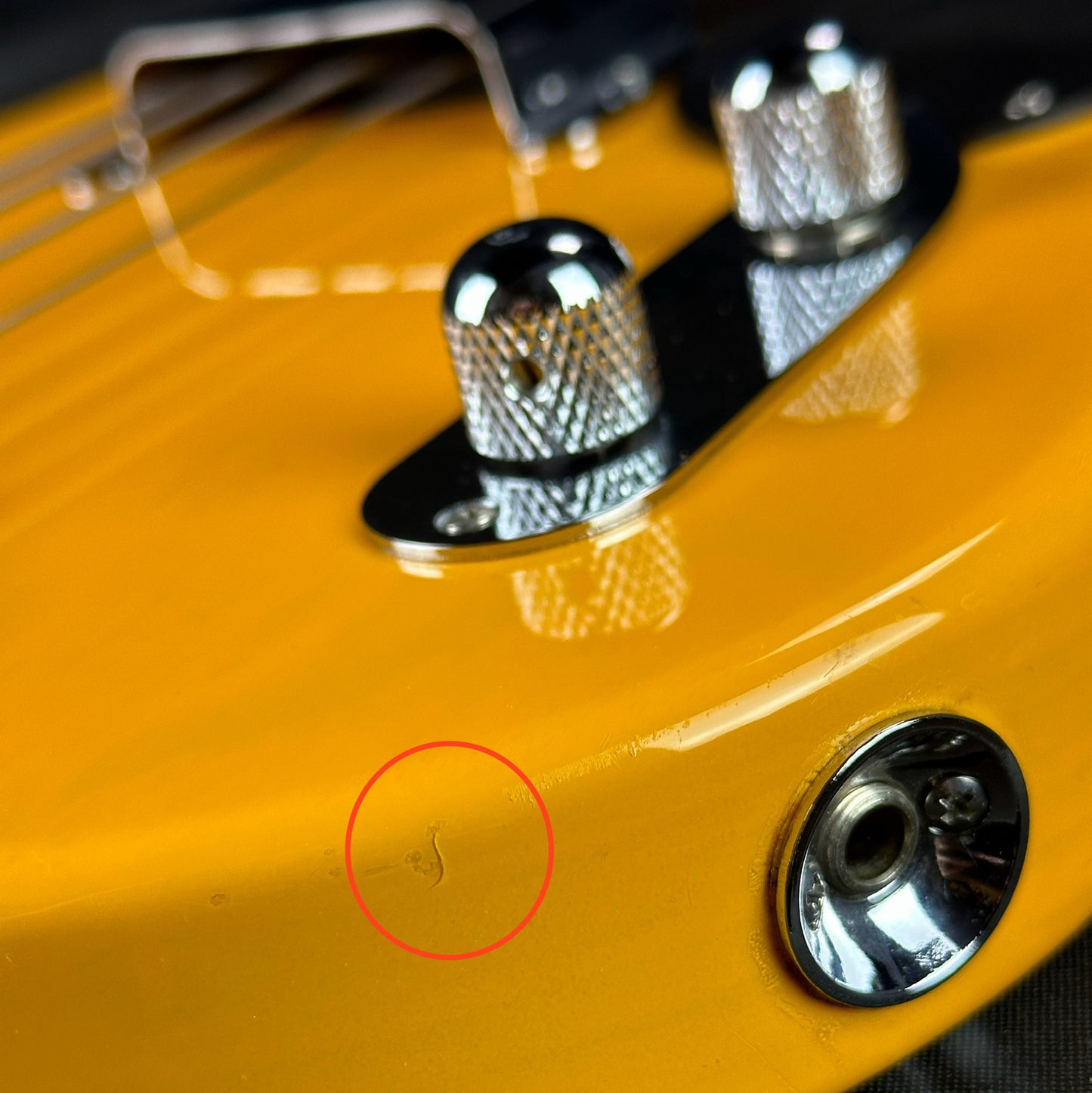 Damage near output jack of Used Fender CIJ '51 Precision Bass.