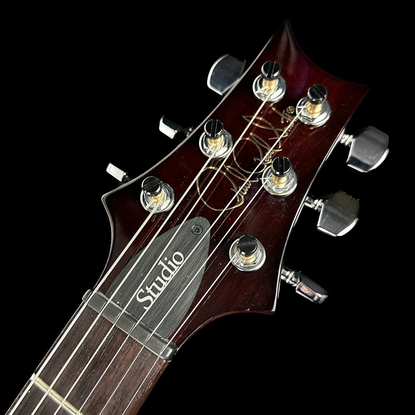 Front of headstock of Used PRS S2 Studio McCarty Tobacco Burst.