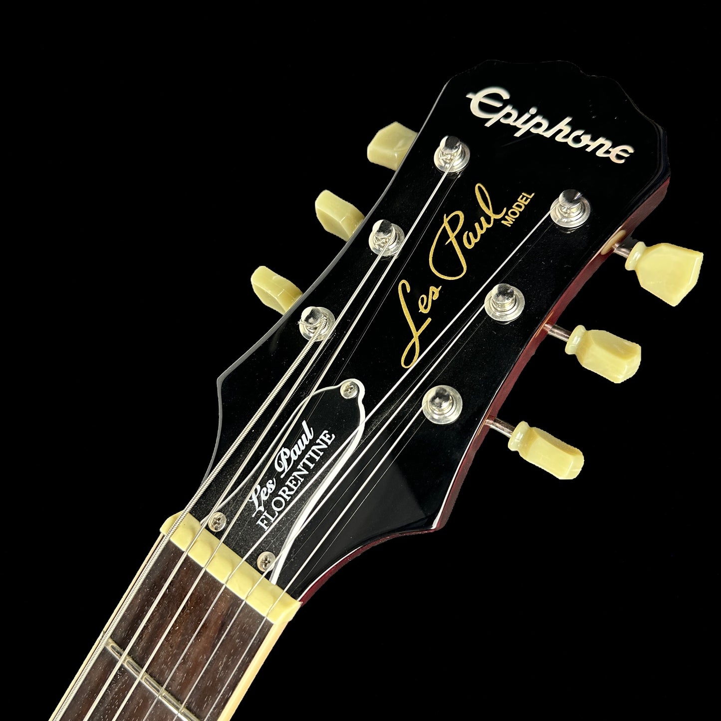 Front of headstock of Used Epiphone Les Paul Florentine Wine.