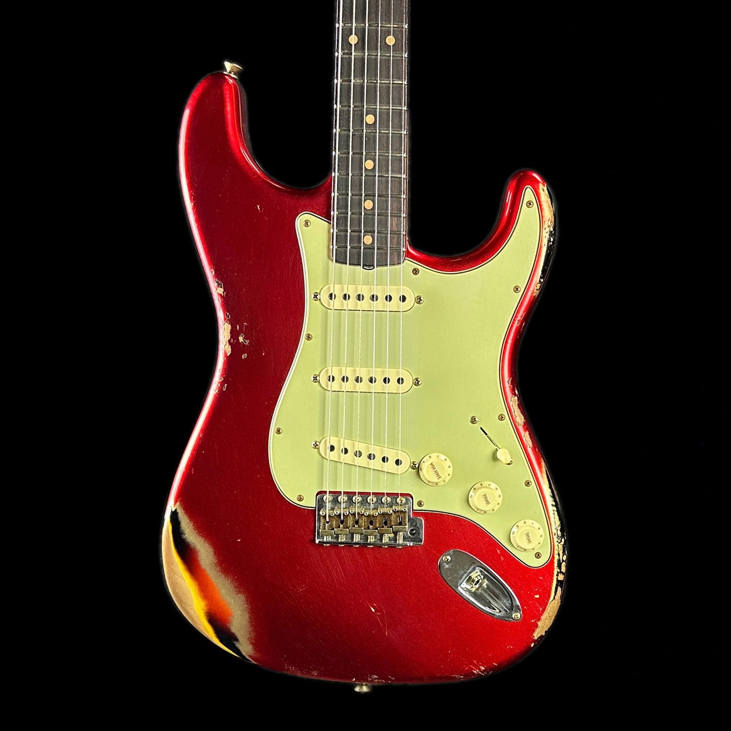 Front of body of Fender Custom Shop Limited Edition '62 Strat Heavy Relic Aged Candy Apple Red Over 3 Color Sunburst.