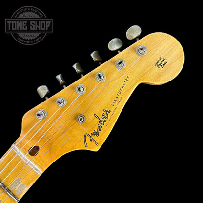 Front of headstock of Fender 1956 Stratocaster Journeyman Relic Maple Neck Aged Black.