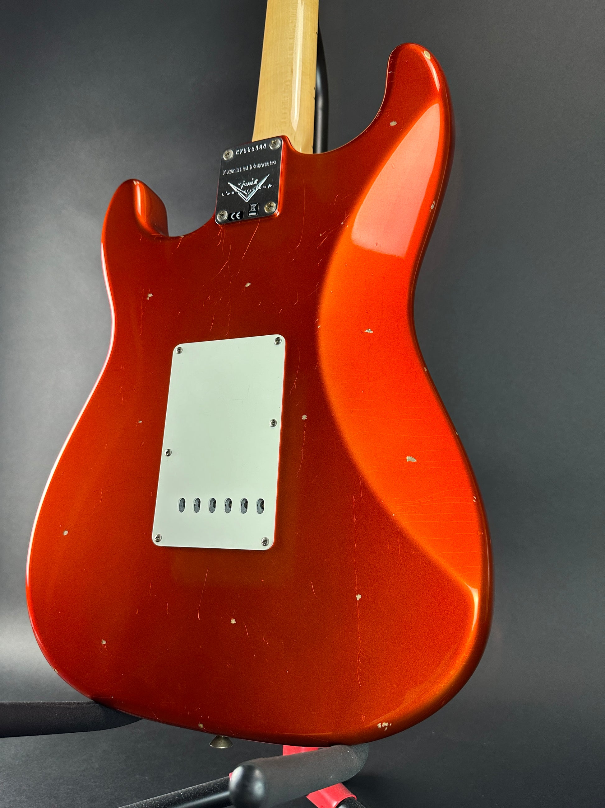 Back angle of Used Fender Custom Shop Ltd Ed 69 Strat Journeyman Relic Aged Candy Tangerine.