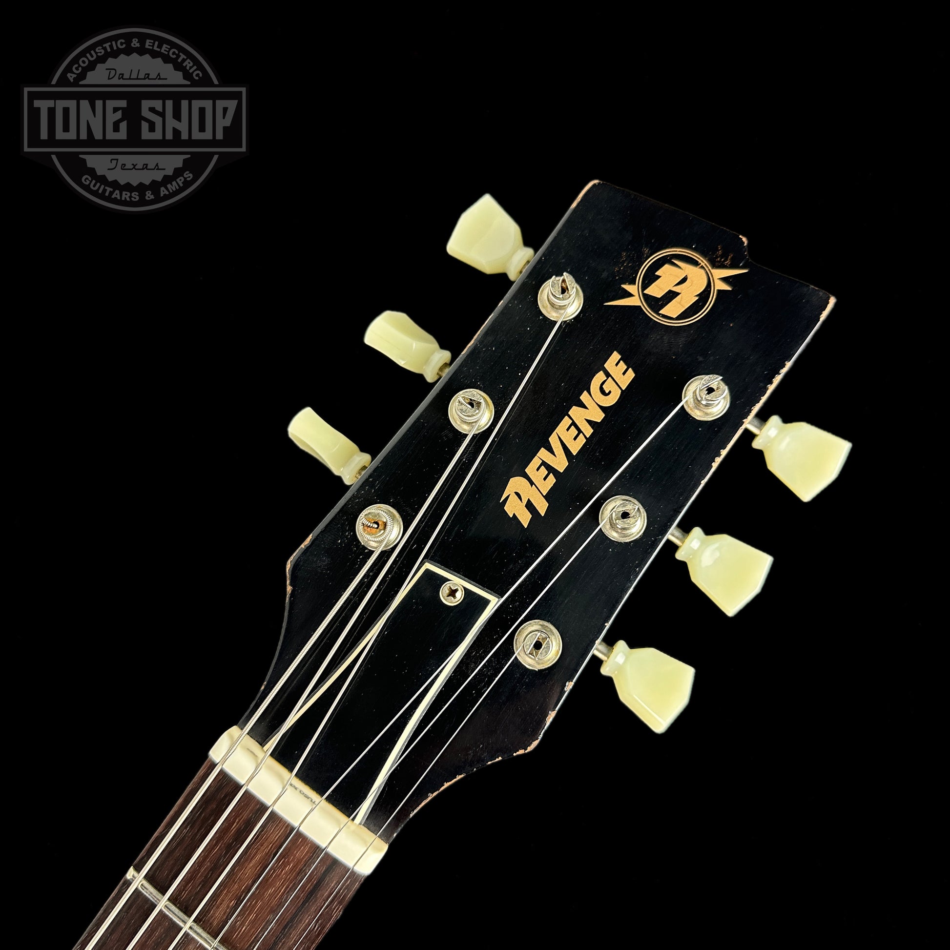 Front of headstock of Rock N Roll Relics Revenge Lake Placid Blue Med Aging.