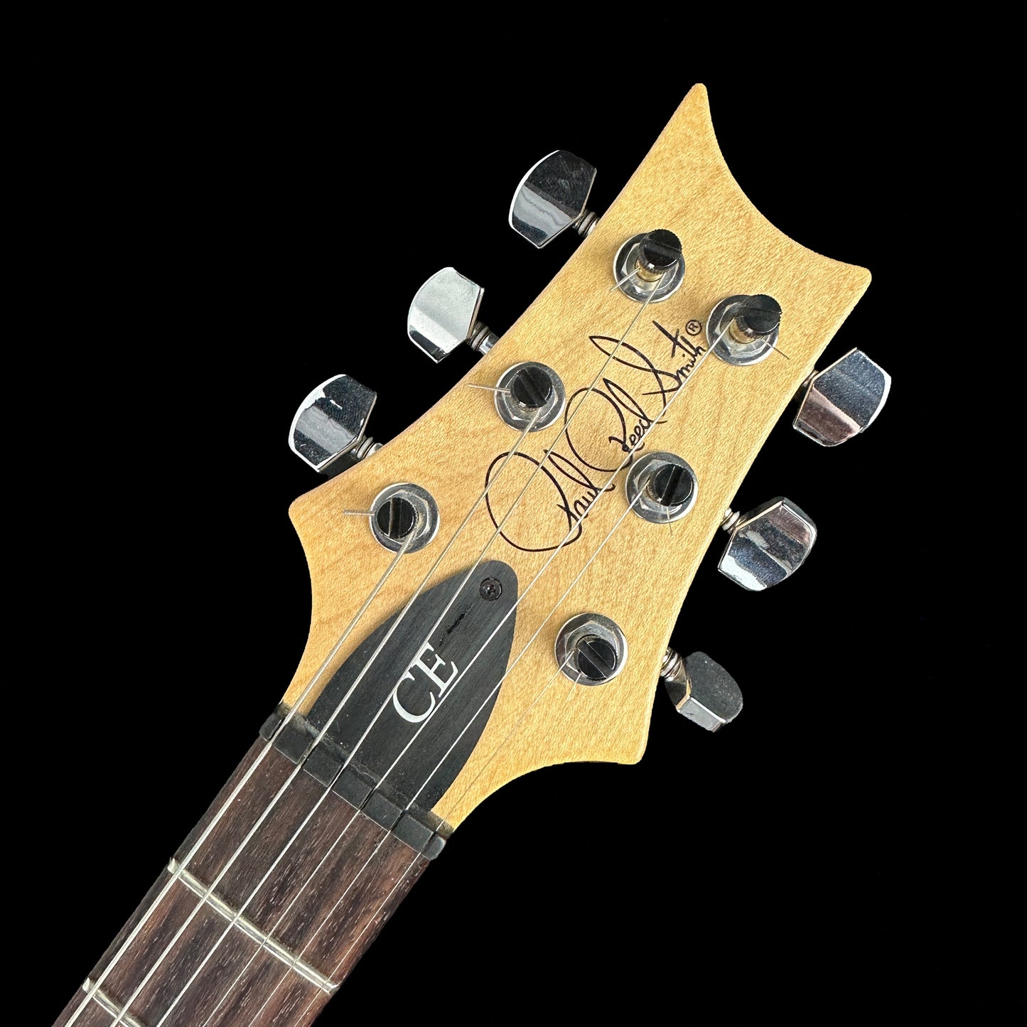 Front of headstock of Used PRS CE24 Amberburst.
