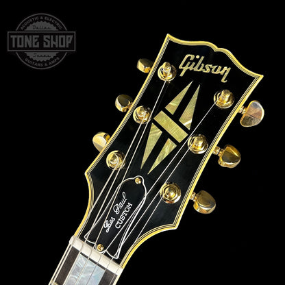 Front of headstock of on Custom Shop M2M Les Paul Custom Antique Silver Murphy Lab Light Aged GH.