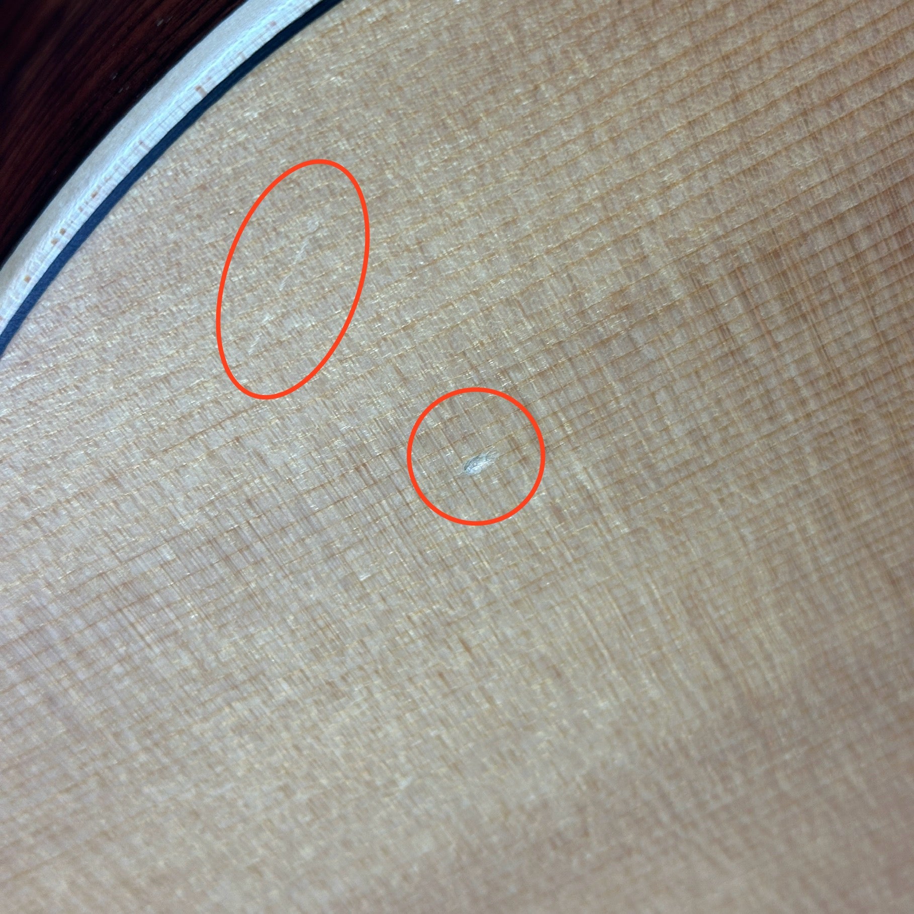 Small scratch and ding on body of Used Larivee L-03-12R.