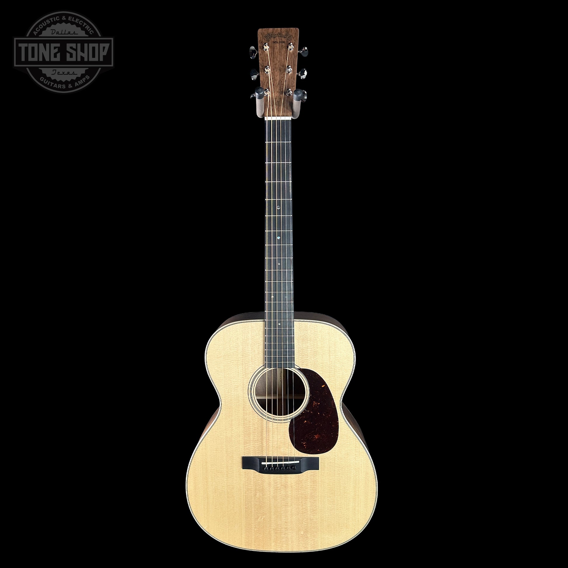 Acoustic guitar on a black background with 'Tone Shop' logo.