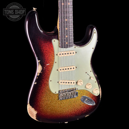 Electric guitar with a sunburst finish on a black background, featuring the Tone Shop logo.