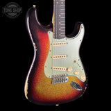 Fender Stratocaster guitar with a sunburst finish on a black background, featuring the Tone Shop logo.