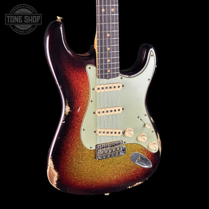Worn electric guitar with a sunburst finish on a black background, featuring the Tone Shop logo.