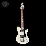 White electric guitar on a black background with 'Tone Shop' logo.