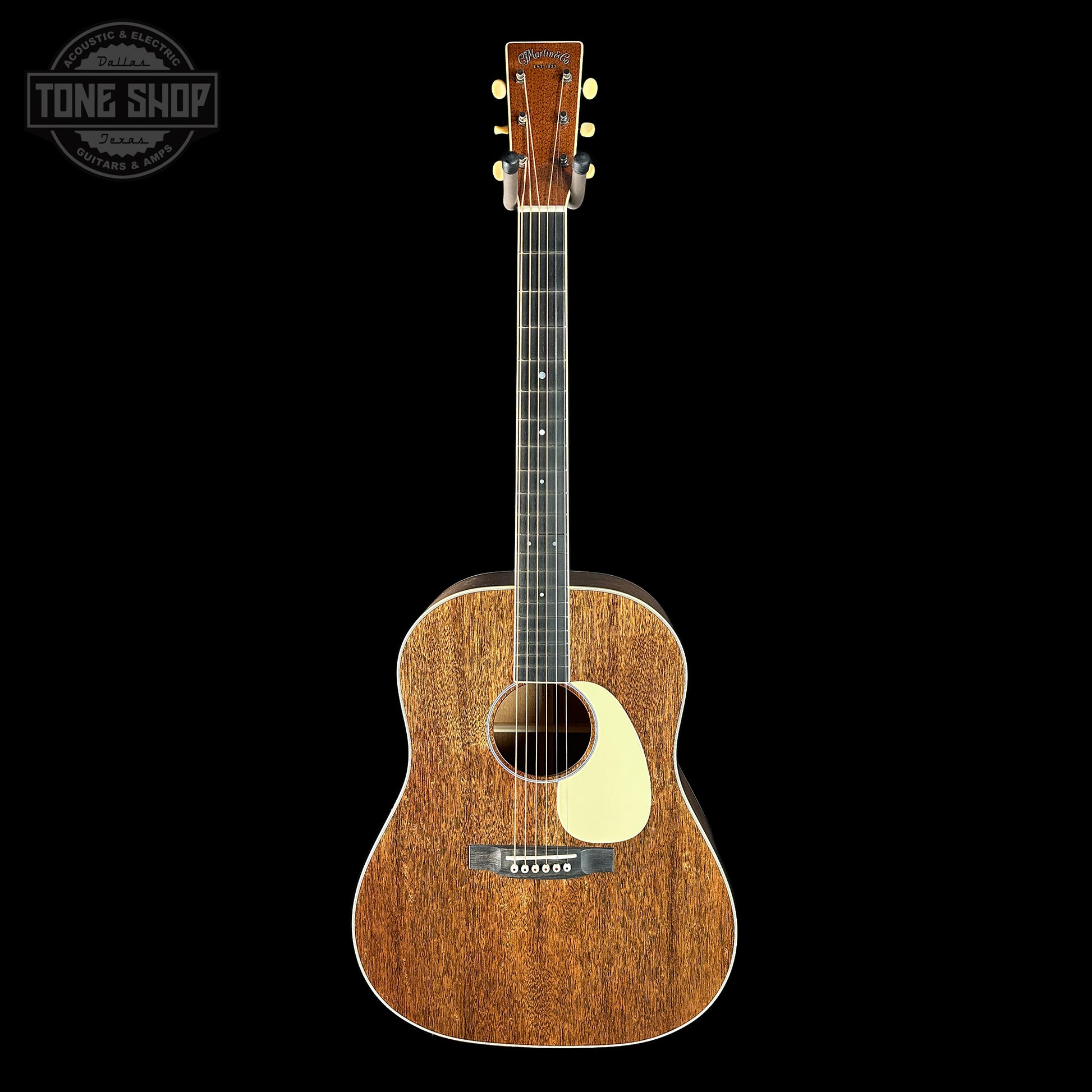 Acoustic guitar with a 'Tone Shop' logo in the corner