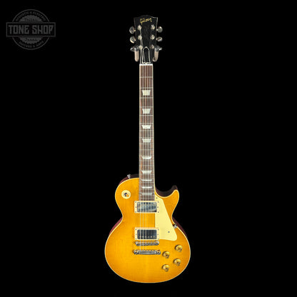 Gibson Les Paul electric guitar with a sunburst finish on a black background