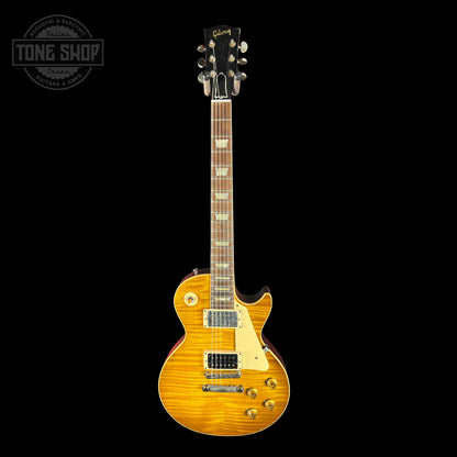 Electric guitar with a sunburst finish on a black background, featuring the Gibson logo.