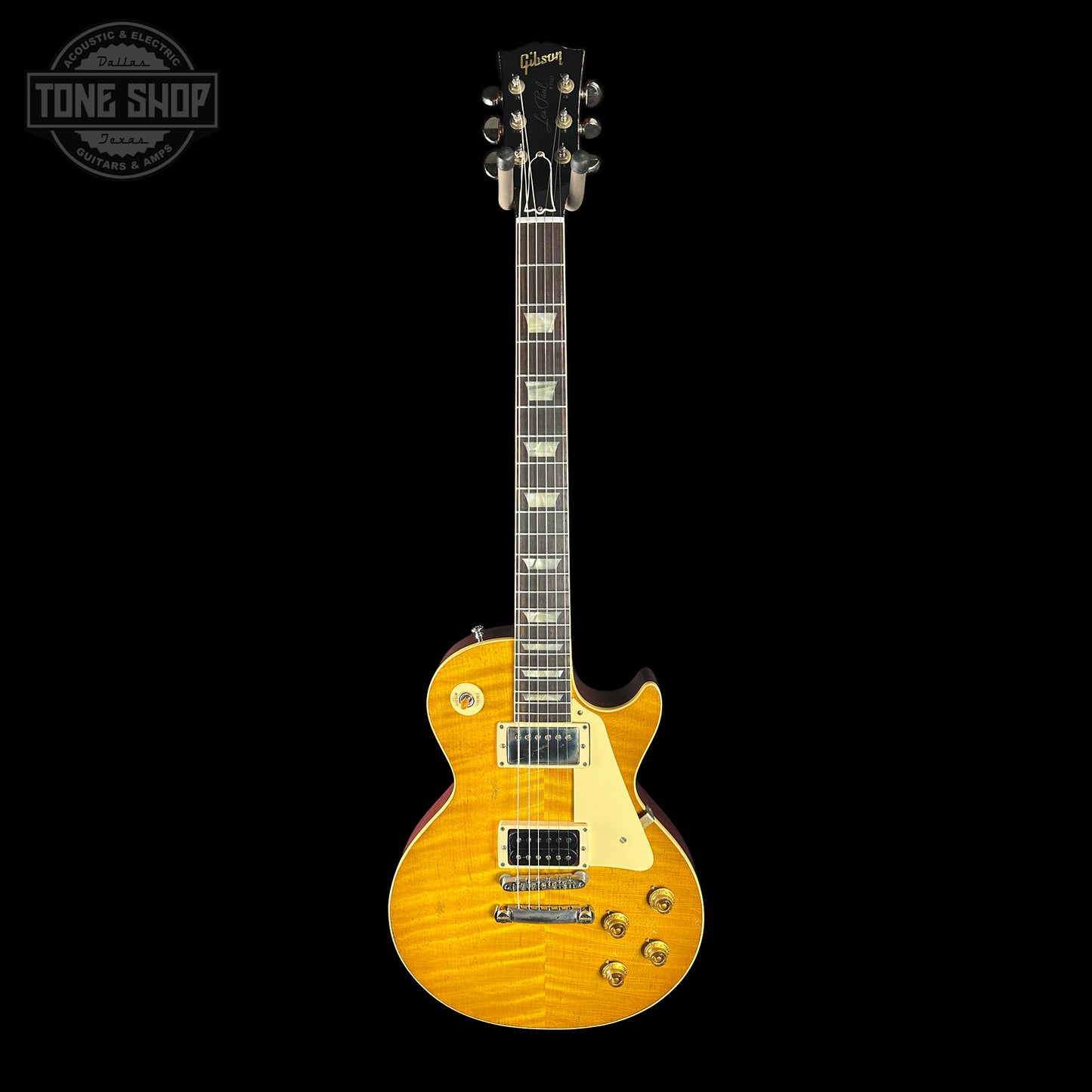 Electric guitar with a sunburst finish on a black background, featuring the Tone Shop logo.