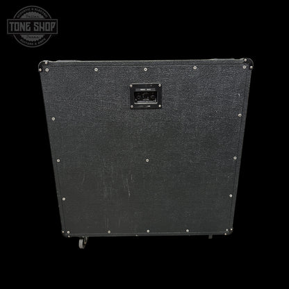 Black guitar amplifier cabinet with visible brand logo on a black background
