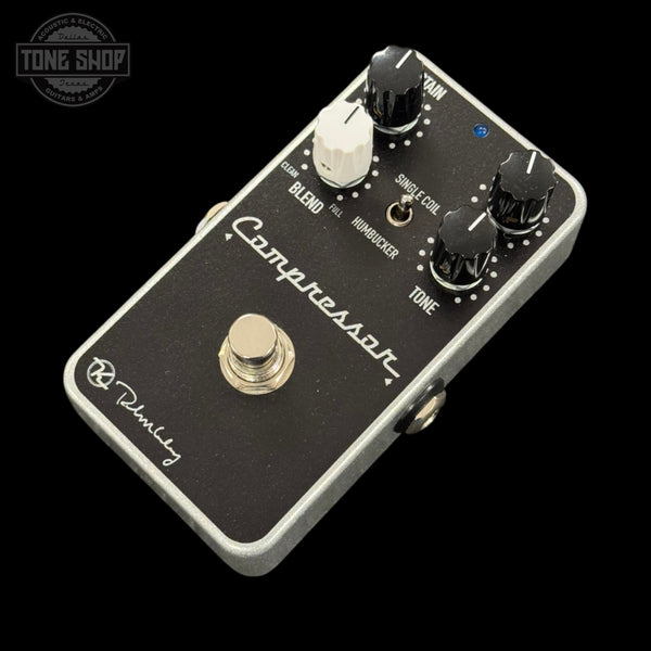 Guitar effects pedal with 'Compressor' branding on a black background