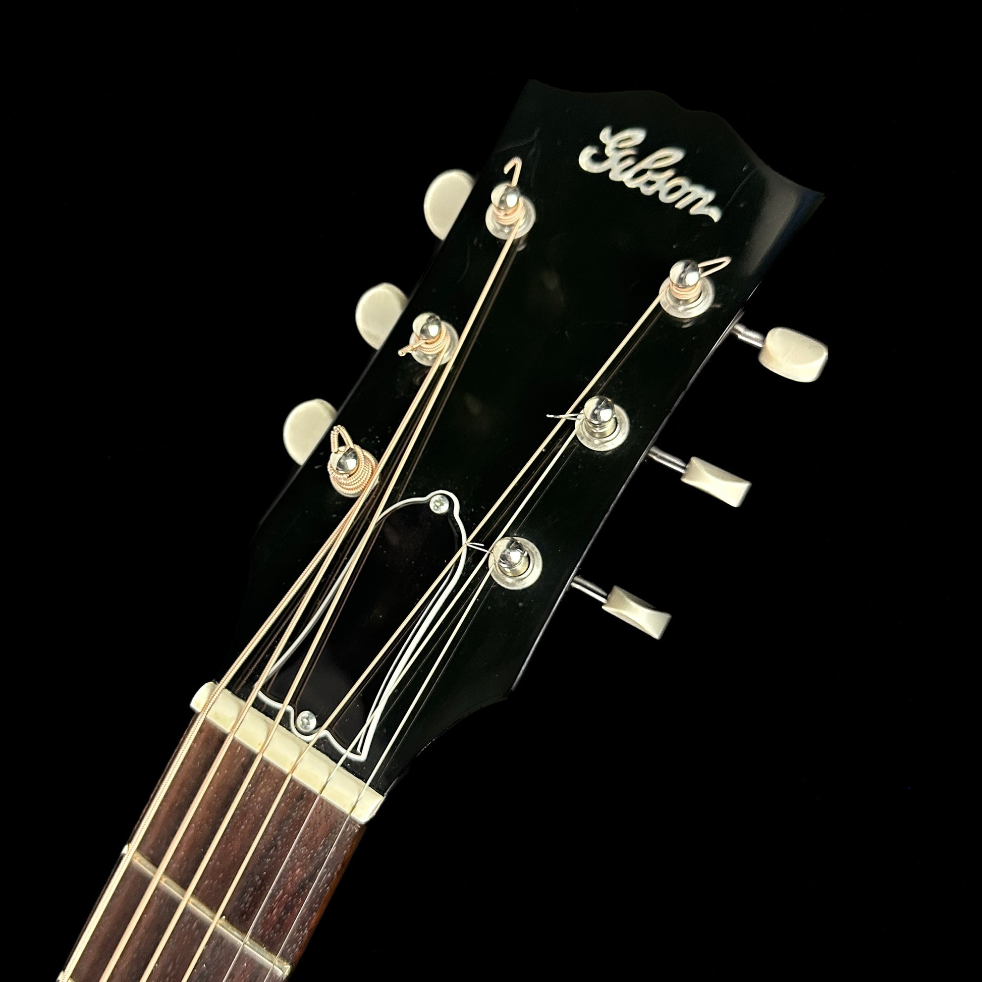 Front of headstock of Used Gibson J-45 12 Fret Edition Burst.