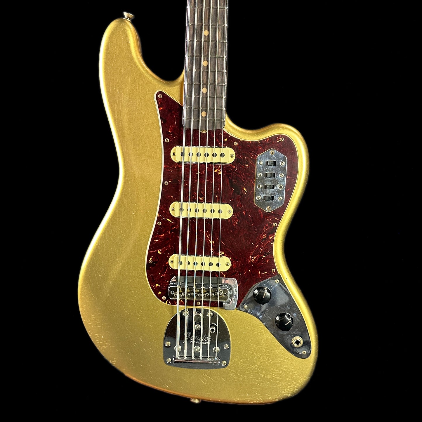 Front of body of Fender Custom Shop Limited Edition Bass VI Journeyman Relic Aged Aztec Gold.