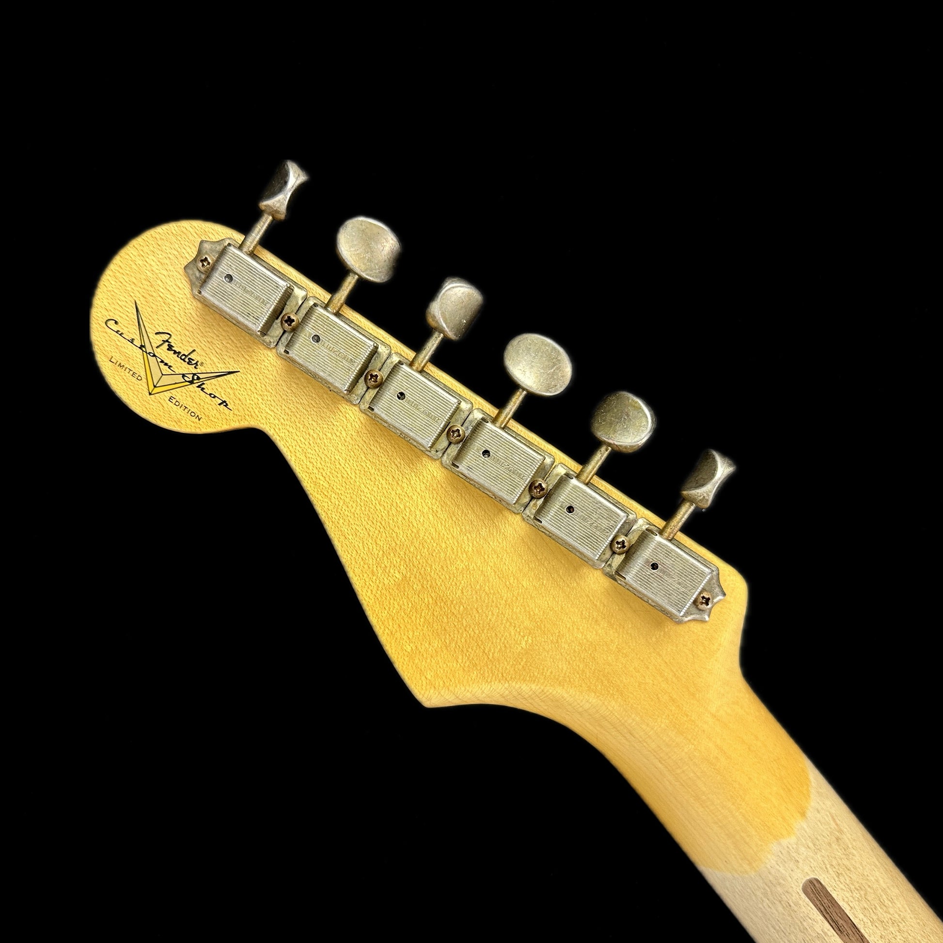 Back of headstock of Fender Custom Shop LTD 70th Anniversary 1954 Stratocaster Journeyman Relic 2-Color Sunburst.