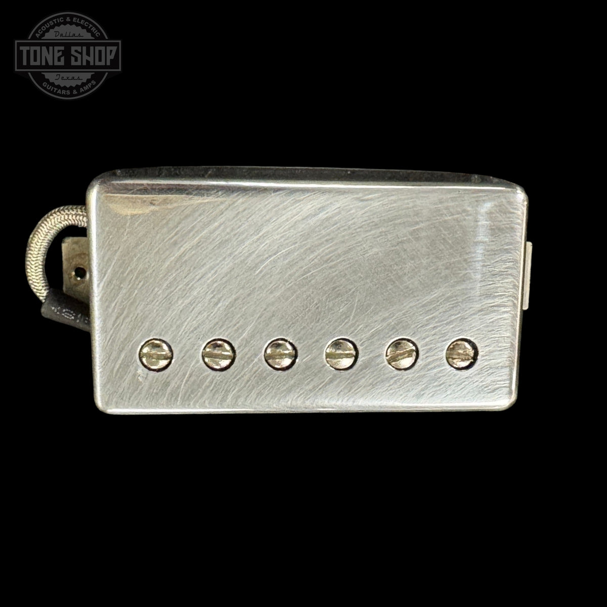 Silver pickup with six screws on a black background, featuring the Tone Shop logo.