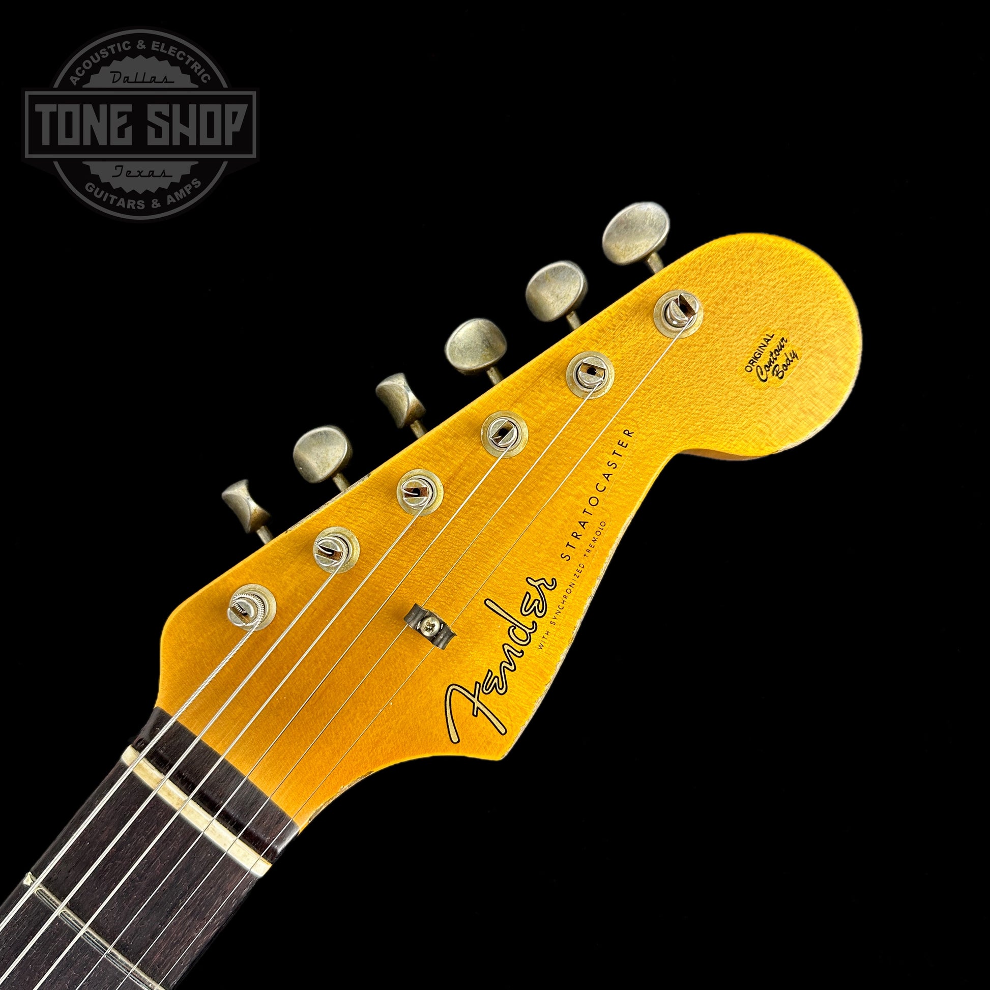 Front of headstock of Fender Custom Shop 2023 Collection 60 Strat Heavy Relic Faded Aged 3 Color Sunburst.