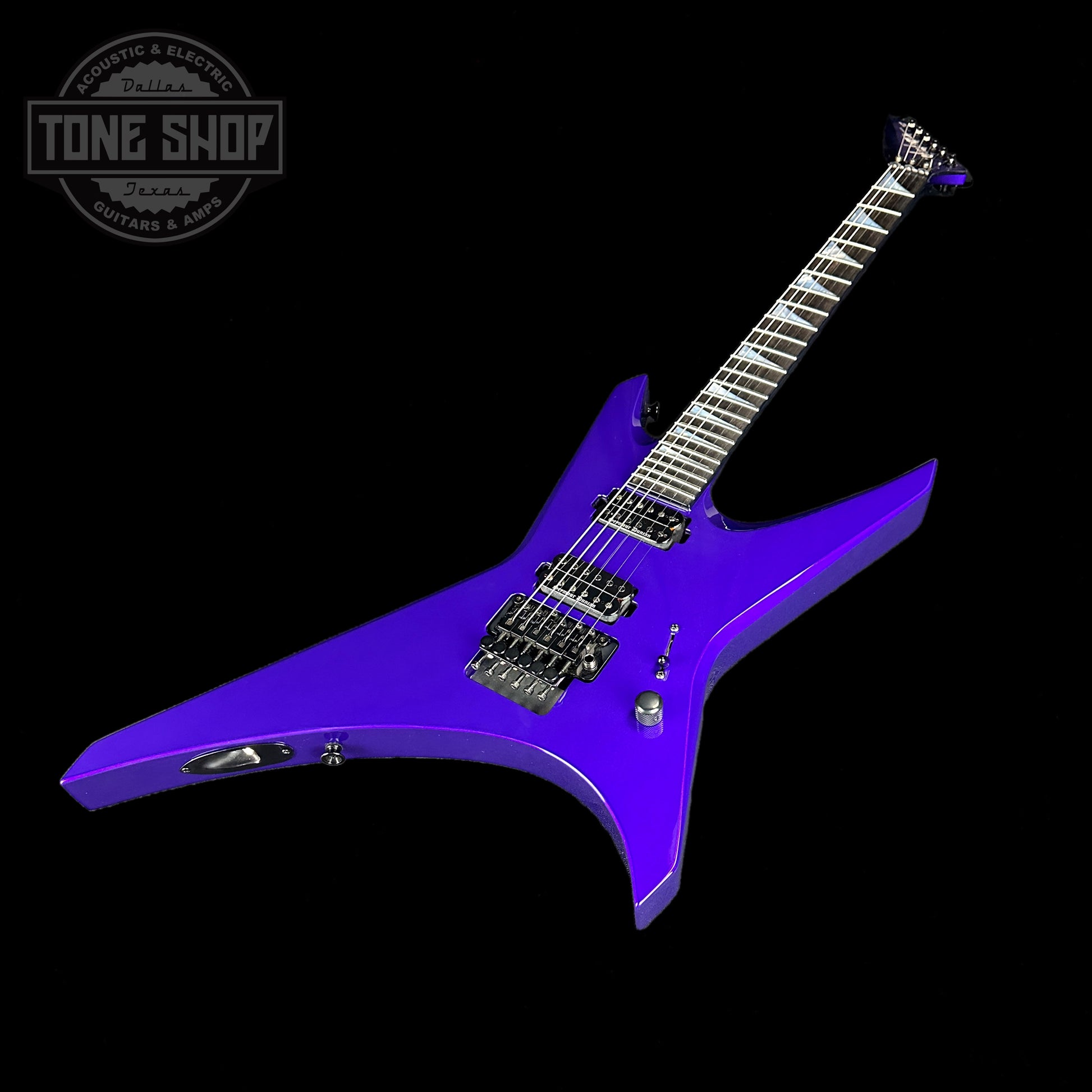 Front angle of Jackson Custom Shop Limited Edition Warrior NOS Purple Metallic.