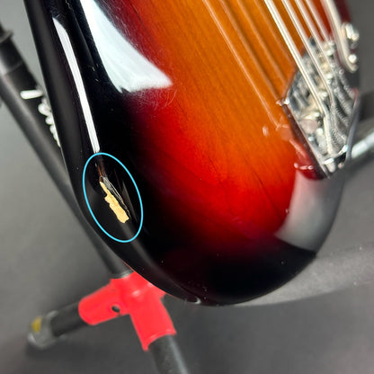 Ding on side of Used 2021 Fender American Pro II Precision Bass Sunburst.