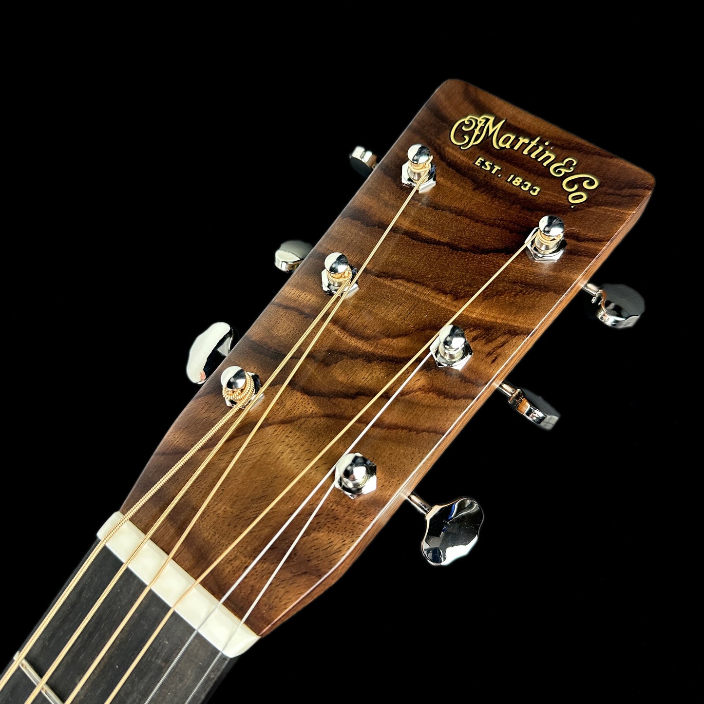 Front of headstock of Martin Custom Shop 28 Style OM Adirondack/WEIR.