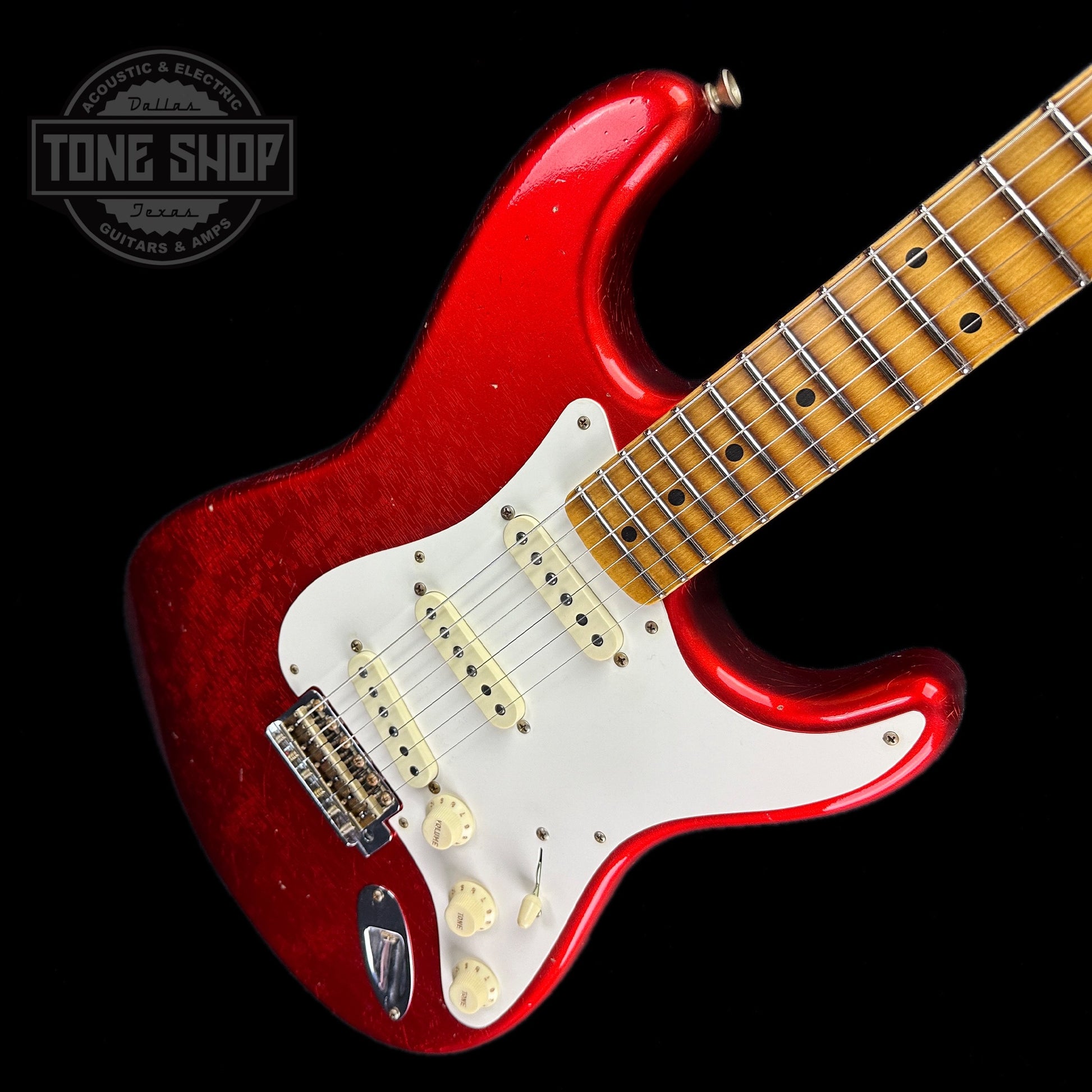 Front angle of Fender Custom Shop Limited Edition 56 Strat Journeyman Relic Super Faded Aged Candy Apple Red.