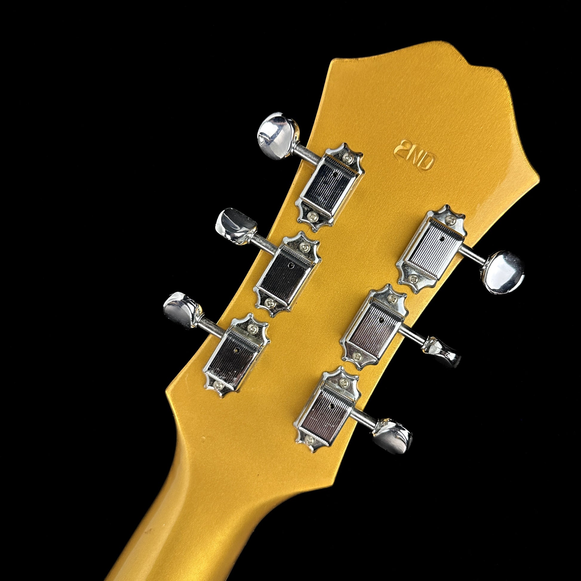 Back of headstock of Used Epiphone Riviera w/bigsby Gold Sparkle.