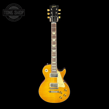 Yellow electric guitar on a black background with 'Tone Shop' logo.