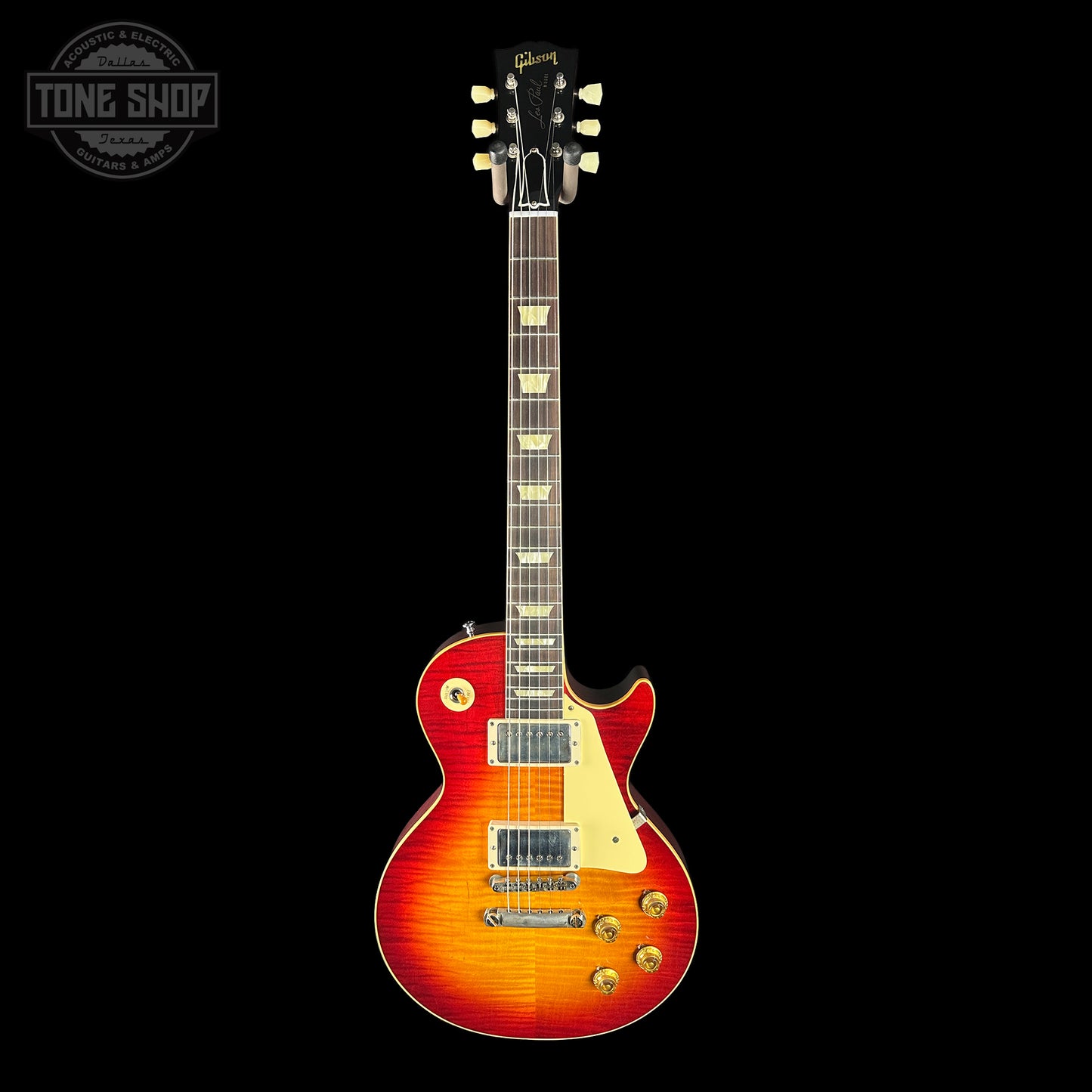 Electric guitar with a sunburst finish on a black background, featuring the Tone Shop logo.