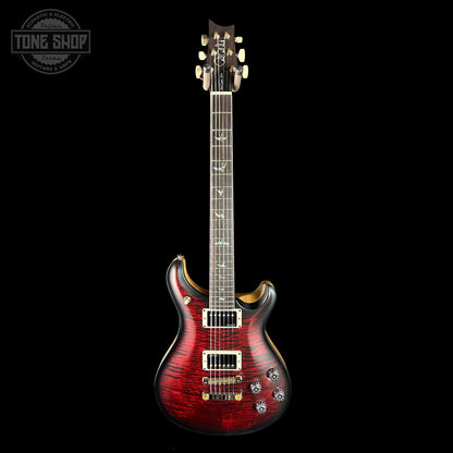 Red electric guitar on a black background with 'Tone Shop' logo.