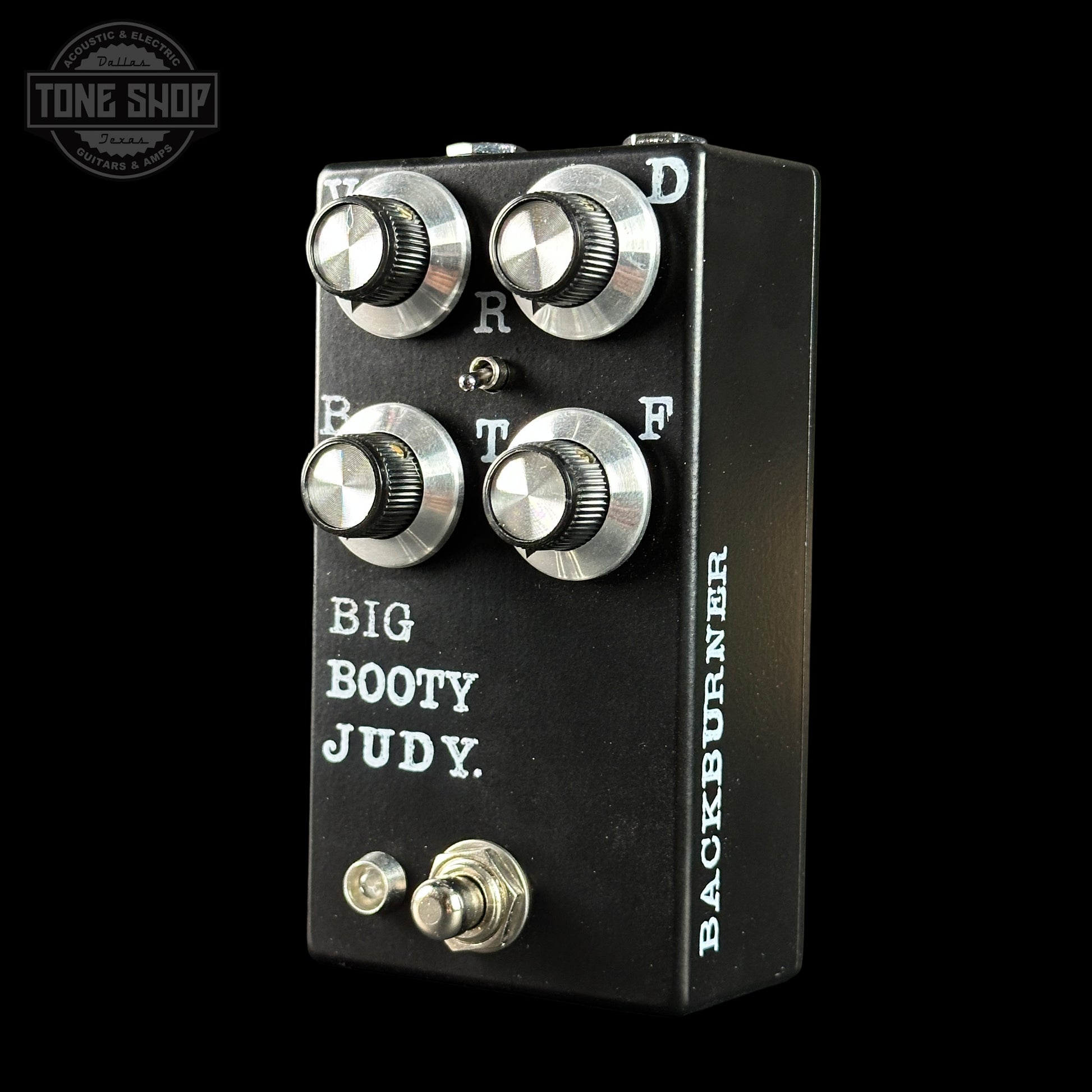 Guitar effects pedal with 'Big Booty Judy' and 'Backburner' branding on a black background.