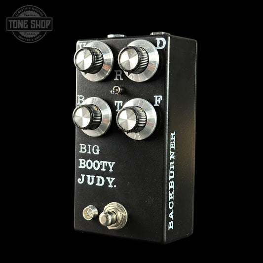 Guitar effects pedal with 'Big Booty Judy' and 'Backburner' branding on a black background.