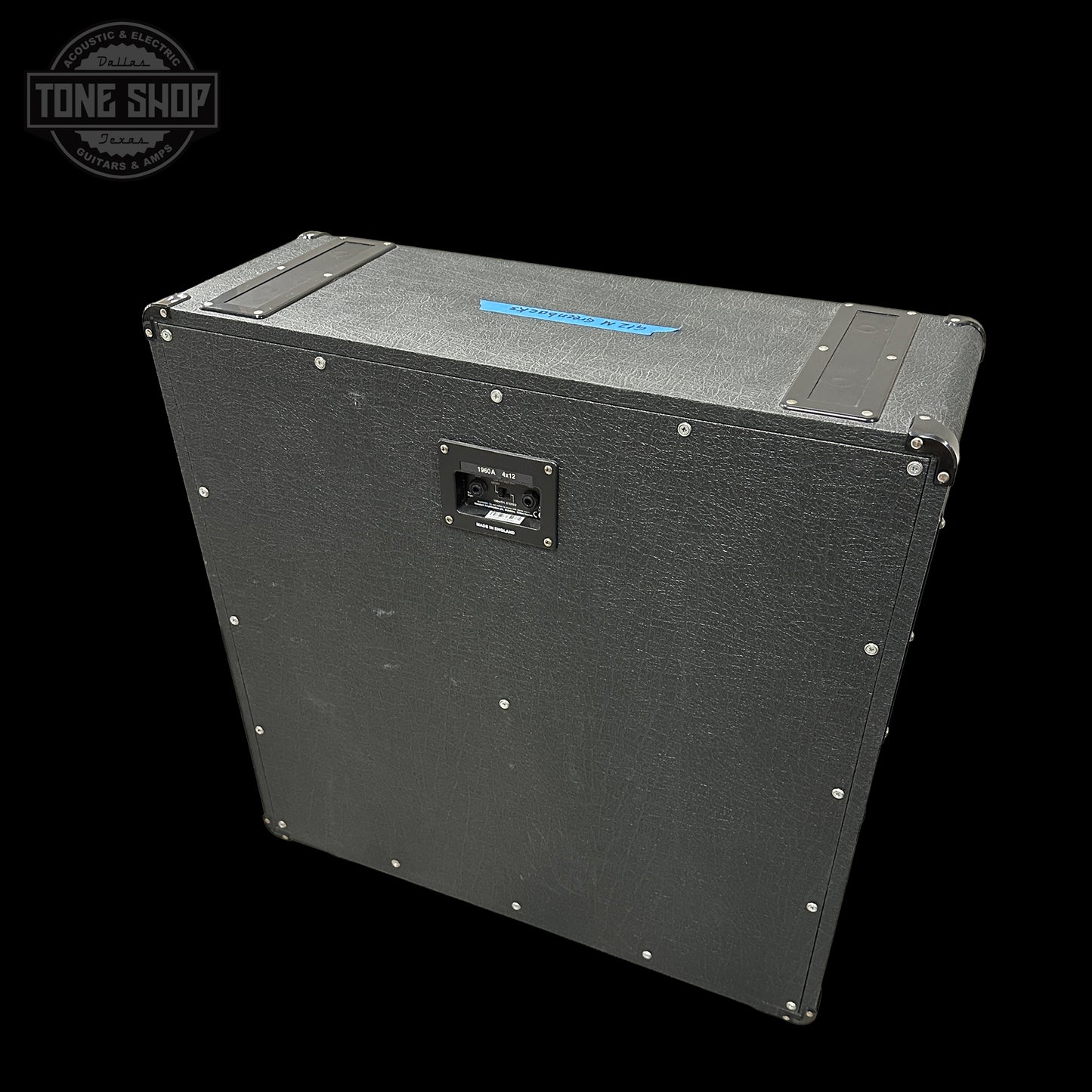 Black guitar amplifier cabinet with 'Tone Shop' logo in the corner