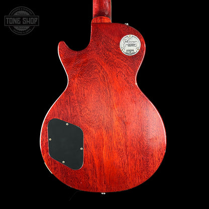 Red electric guitar body with Gibson logo on a black background