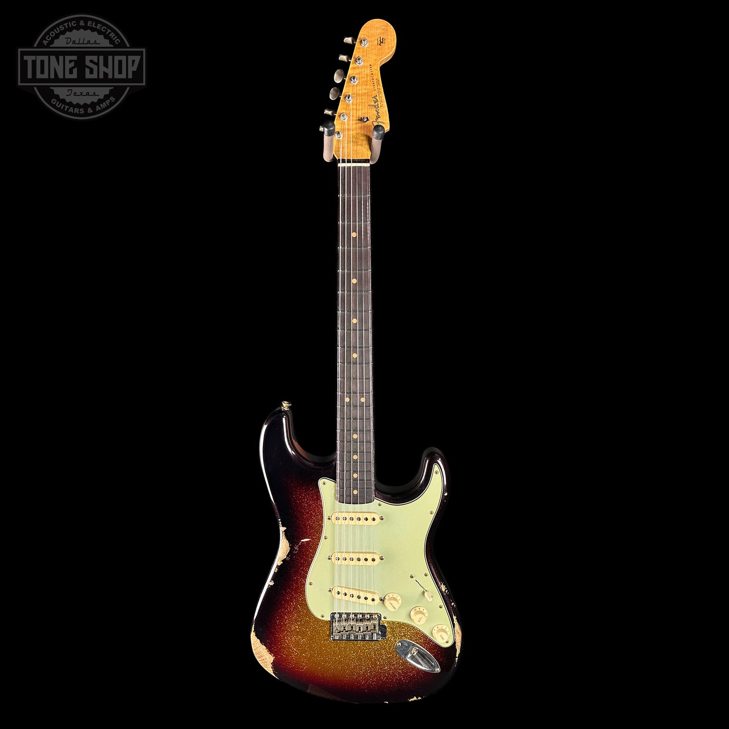 Electric guitar with a sunburst finish on a black background, featuring the Tone Shop logo.