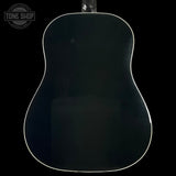 Back view of an acoustic guitar with a black finish on a black background, featuring the Tone Shop logo.