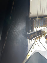 Damage/wear on Used 2002 Epiphone 58 Reissue Flying V Black.