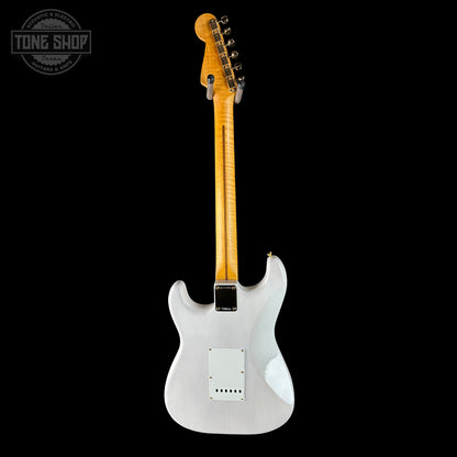 White electric guitar with a wooden neck on a black background, featuring 'Tone Shop' logo.