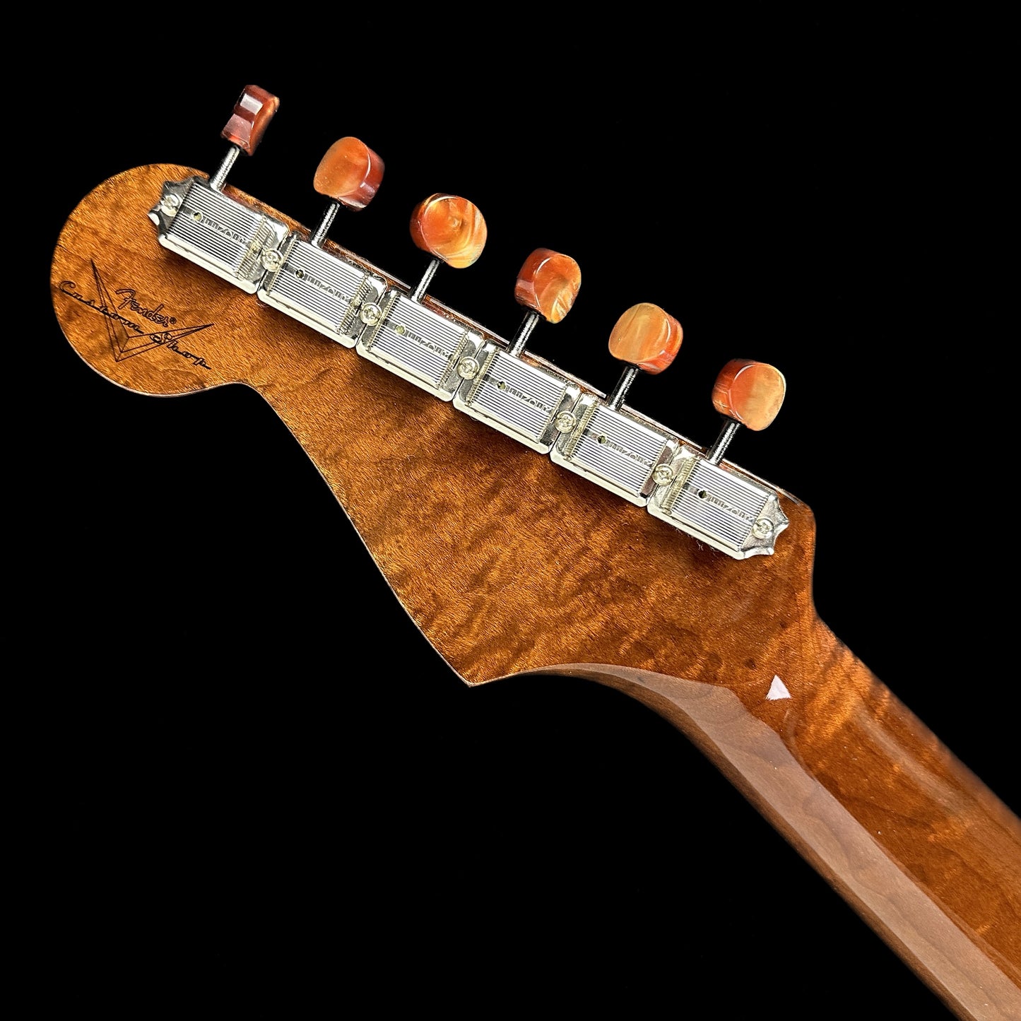 Back of headstock of Fender Custom Shop Artisan Dual P90 Koa Strat NOS RW Aged Natural.